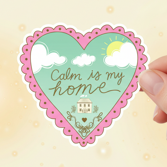 Heart-shaped sticker with 'Calm is my home' text held by a hand on a light background