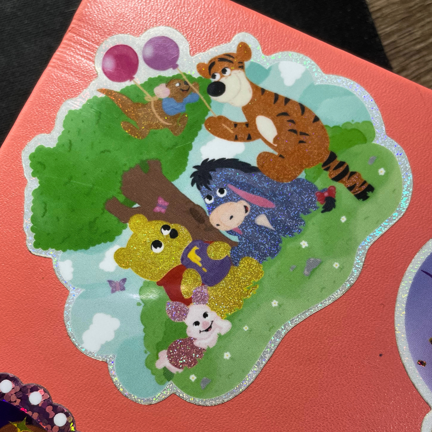 Colorful sticker of cartoon characters on a red background